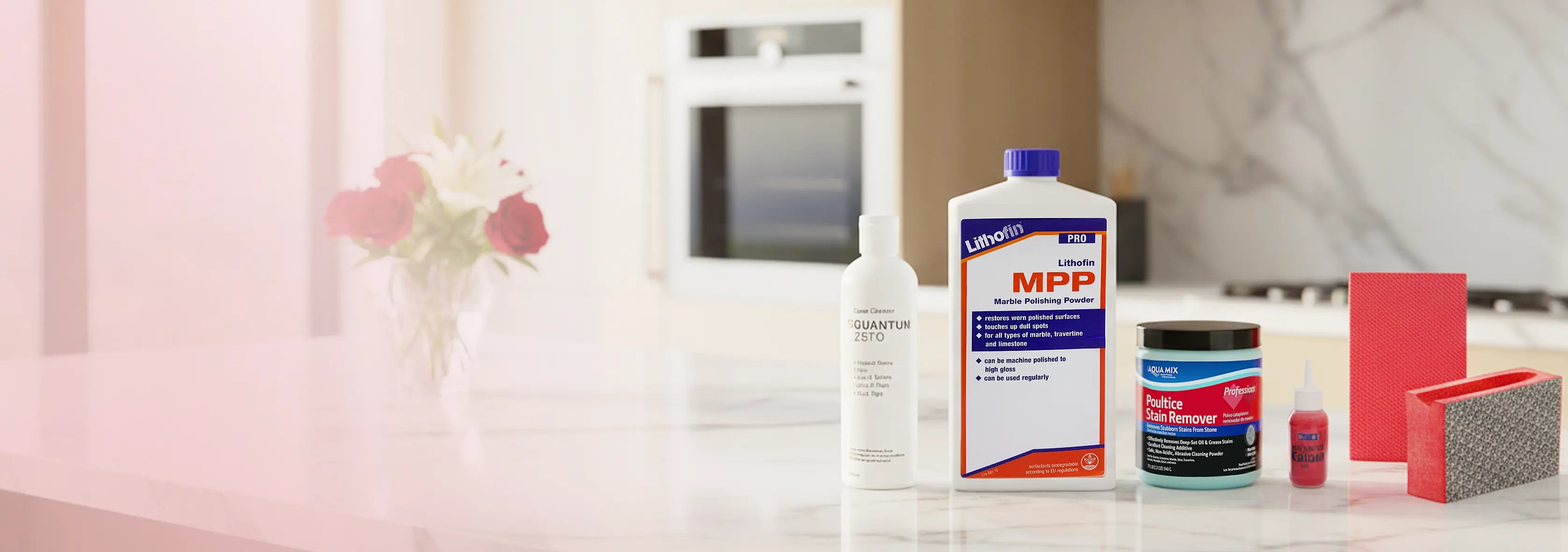 Cleaning products on a kitchen counter with a blurred background