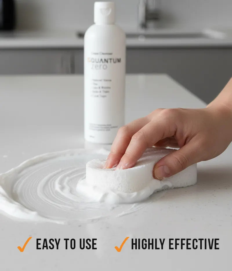 Person using a cleaning product on a surface with a bottle labeled 'Quantum' in the background.