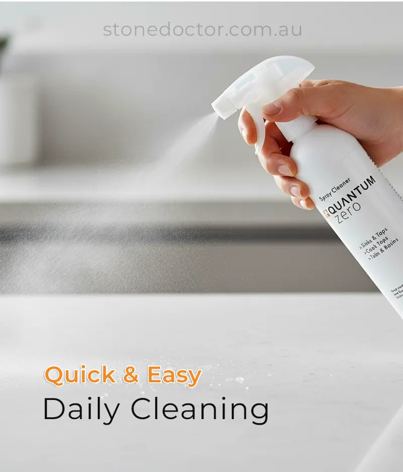 Hand holding a spray bottle labeled 'Quantum Zero' over a sink with text 'Quick & Easy Daily Cleaning'.